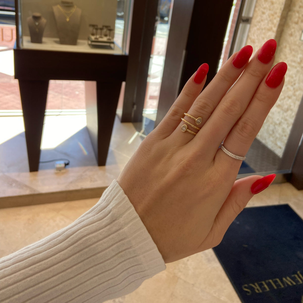 Female Model Wearing Diamond Wave Stackable Ring - 14K gold weighing 1.82 grams - 74 round diamonds weighing 0.36 carats