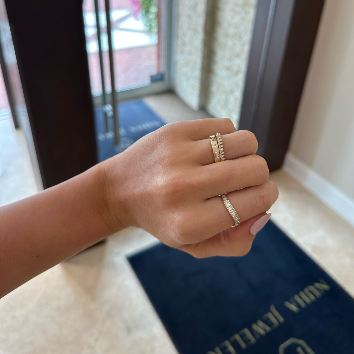 Female Model Wearing Baguette Diamond Wave Stackable Ring - 14K gold weighing 1.55 grams - 35 tapered baguette diamonds weighing 0.90 carats