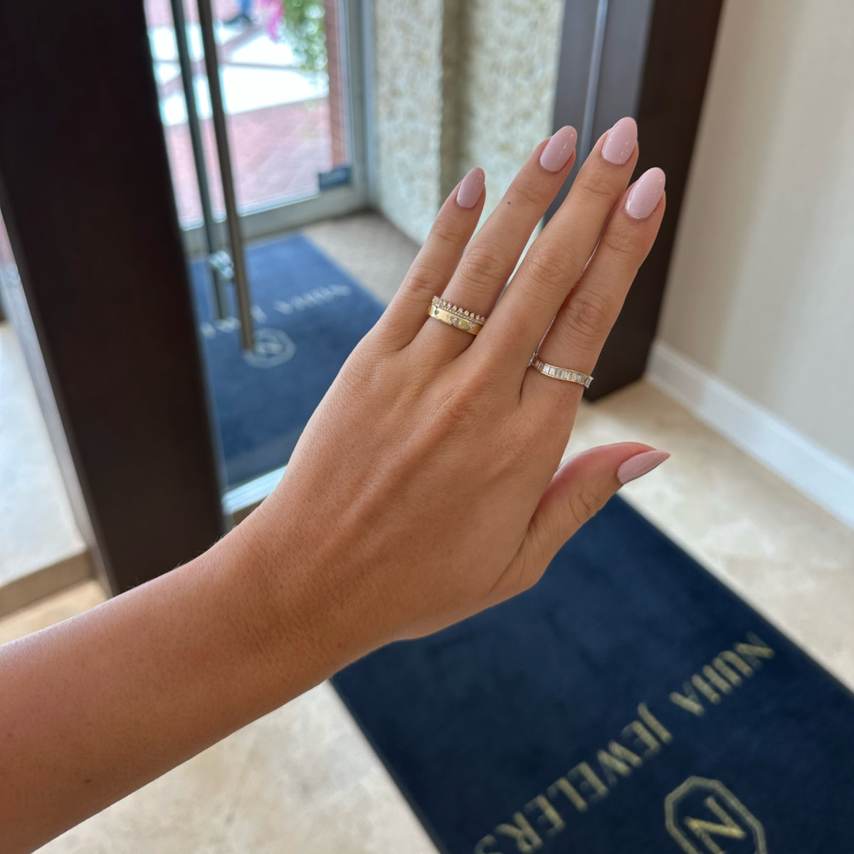 Female Model Wearing Heart Diamond Stackable Ring - 14K gold weighing 4.53 grams - 10 heart-shaped diamonds weighing 0.54 carats