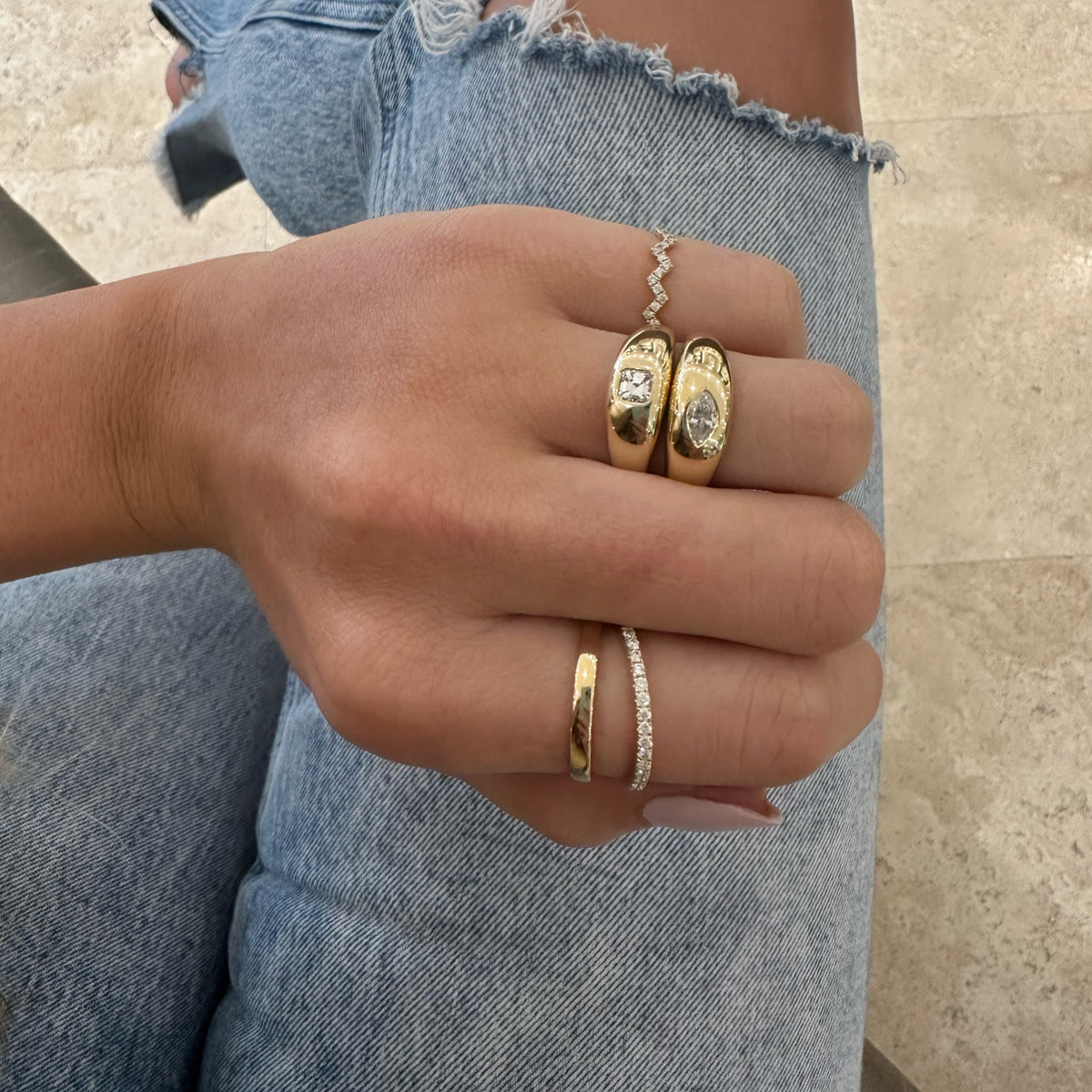 Female Model Wearing Diamond Double-Banded Open Ring - 14K gold weighing 3.74 grams - 19 round diamonds weighing 0.28 carats