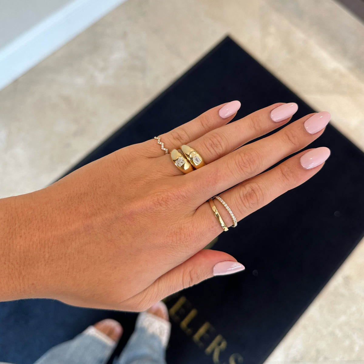 Female Model Wearing Diamond Double-Banded Open Ring - 14K gold weighing 3.74 grams - 19 round diamonds weighing 0.28 carats