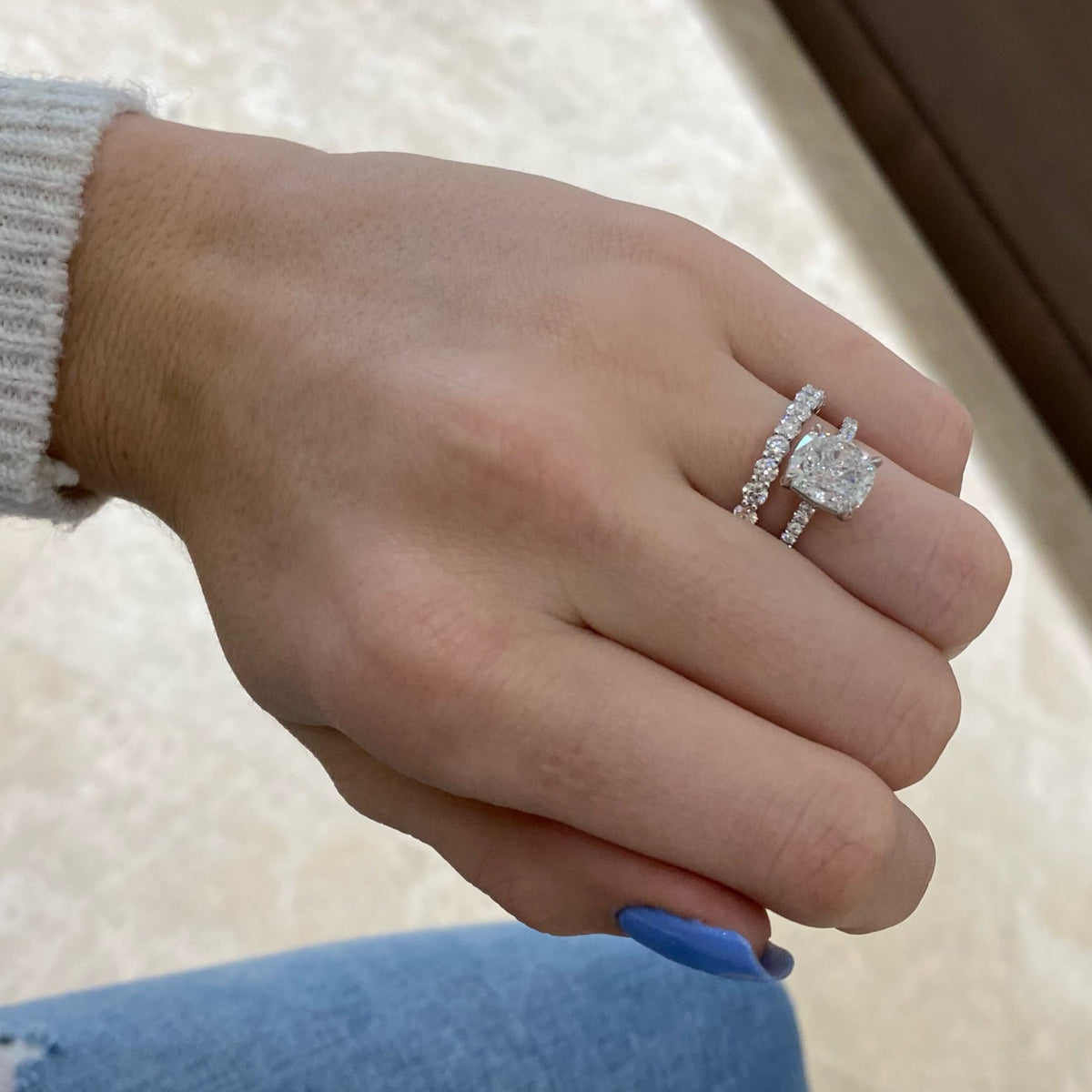 Female Model Wearing 0.81 ct Diamond Wedding Band - 18K gold weighing 2.32 grams  - 11 round diamonds weighing 0.81 carats