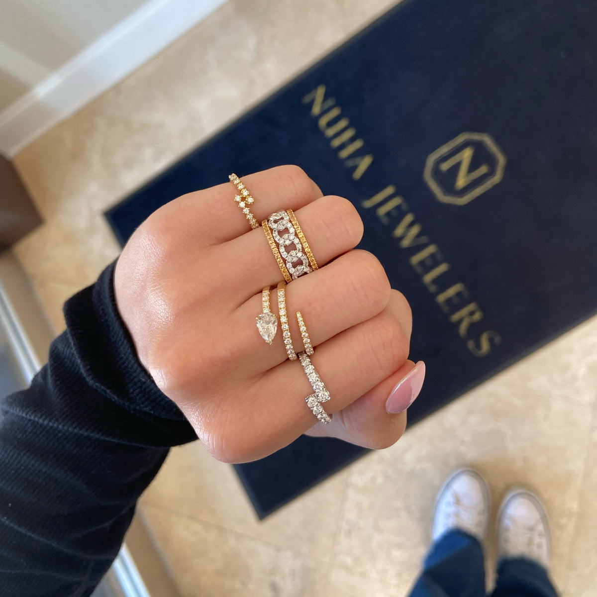 Female Model Wearing Diamond Simple Wrap Ring - 18K gold weighing 3.28 grams - 14 round diamonds weighing 0.62 carats