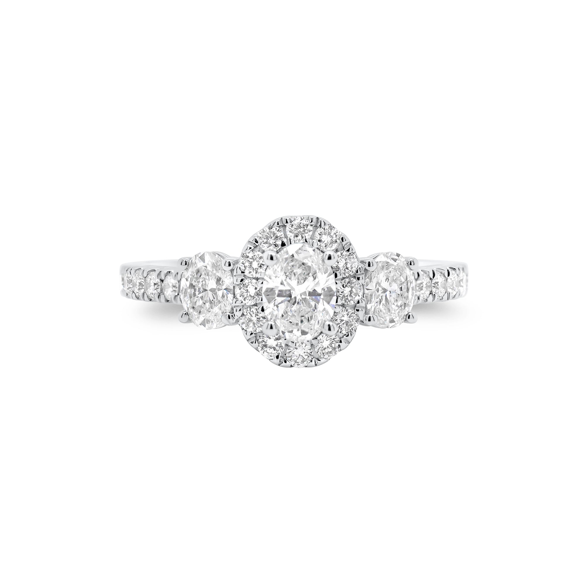 Oval Diamond Halo Three-Stone Engagement Ring - 18K gold weighing 2.90 grams  - 0.31 ct oval-shaped diamond  - 2 oval-shaped diamonds weighing 0.33 carats  - 24 round diamonds weighing 0.31 carats