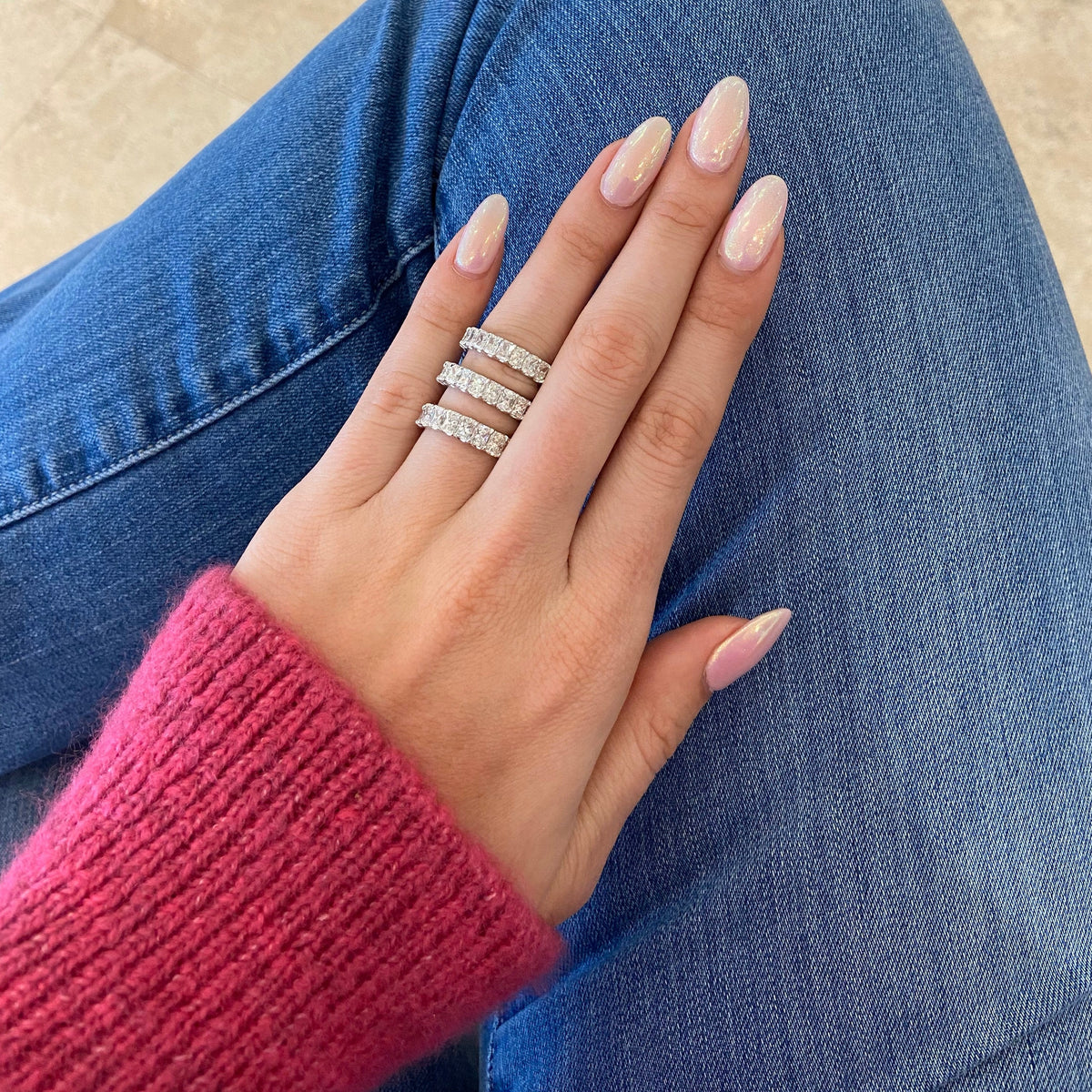 Female Model Wearing 3.55 ct Radiant-Cut Diamond Eternity Band - 18K gold weighing 3.89 grams  - 23 radiant-cut diamonds weighing 3.55 carats (GIA-graded F-color, VS clarity)