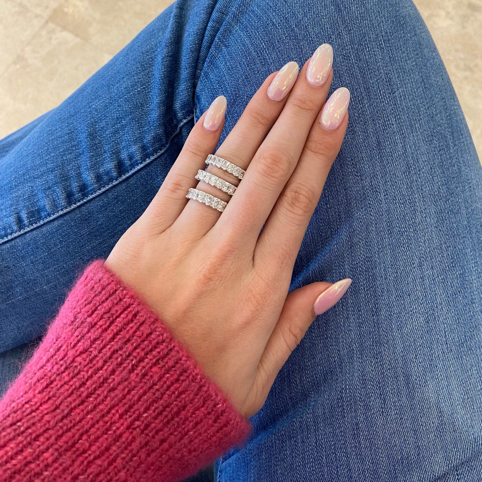 5.05 ct Radiant-Cut Diamond Eternity Band - 18K gold weighing 3.50 grams  - 21 radiant-cut diamonds weighing 5.05 carats (GIA-graded F-color, VS clarity)