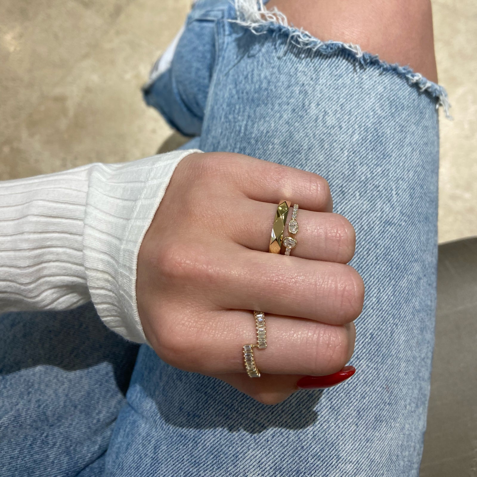 Bezel-Set Oval Diamond Open Ring - 14K gold weighing 1.38 grams  - 2 oval diamonds weighing 0.26 carats  - 13 round diamonds weighing 0.18 carats