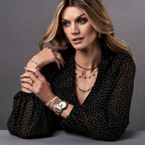 Female model wearing Pave Set Diamond Bar Curbed Link Bracelet -18K gold weighing 16.87 grams -96 round pave-set diamonds totaling 1.33 carats