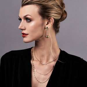 Female Model Wearing Diamond Bezels Graduated Necklace  - 14K gold weighing 4.21 grams  - 25 round diamonds totaling 0.73 carats