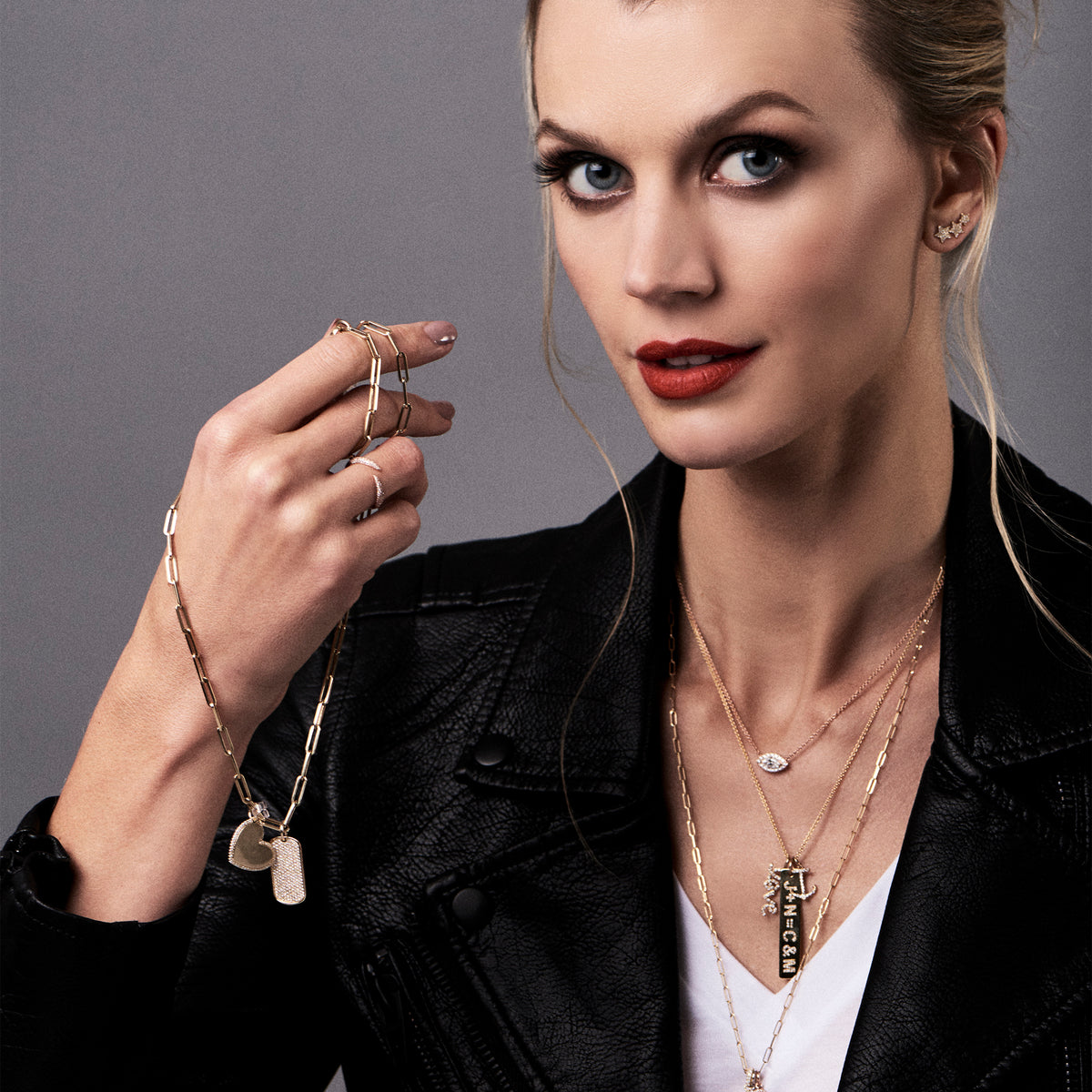 Female model wearing Diamond Anchor Pendant -19 round diamonds totaling 0.10 carats -14kt gold with a total weight of 0.5 grams