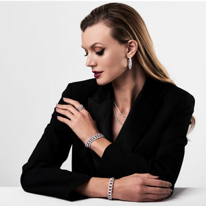 Female Model Wearing Diamond Scribble Ring  -18K gold weighing 7.19 grams  -59 round diamonds totaling 2.81 carats