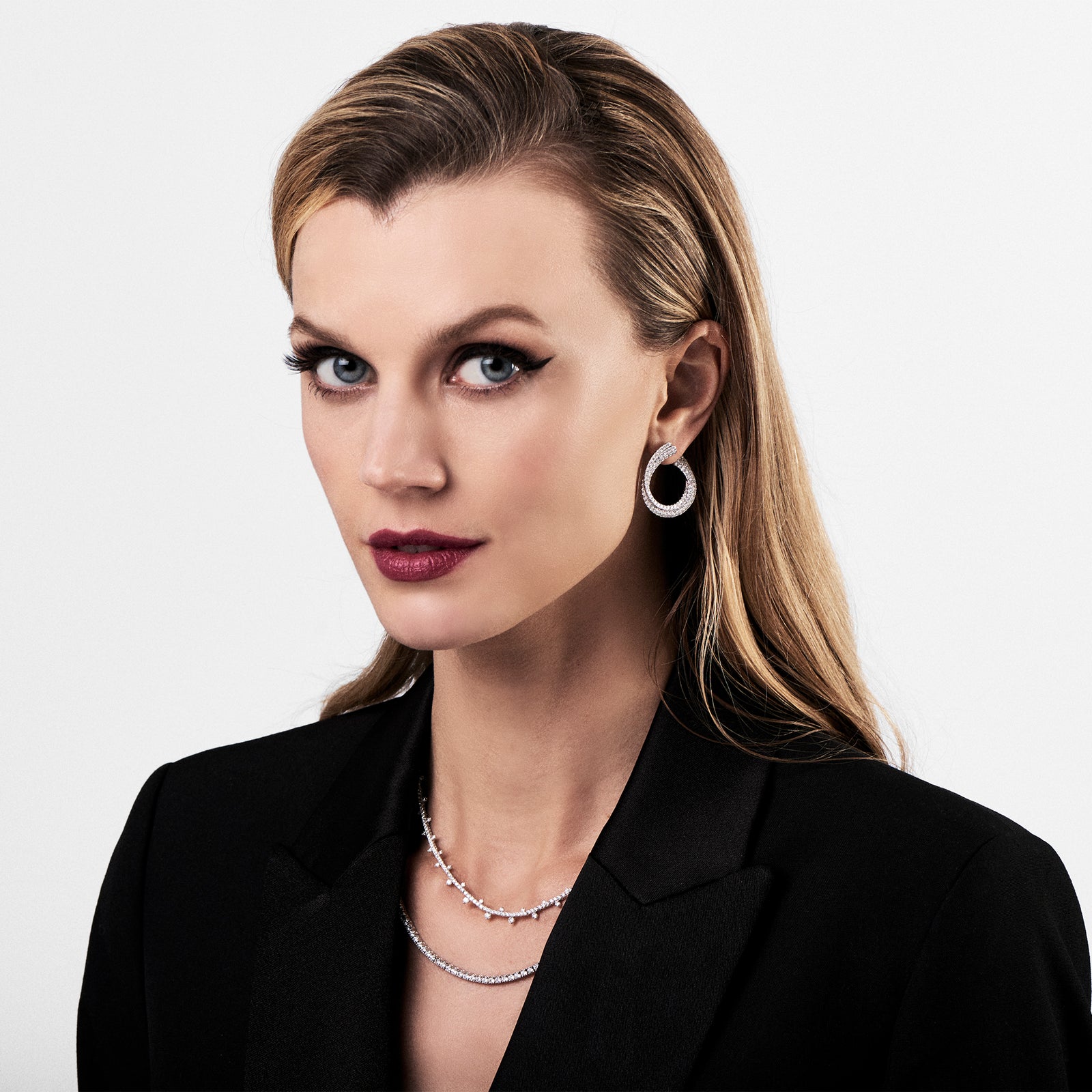 Diamond Front-Facing Twist Hoop Earrings     -14K gold weighing 9.71 grams  -214 round pave-set diamonds totaling 3.55 carats