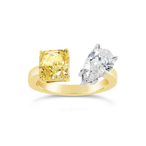 Unique Mixed Shape Two-stone Diamond Ring  -14k gold weighing 3.99 grams  -1 pear-shaped diamond weighing 1.25 carats  -1 fancy light yellow diamond radiant-cut weighing 1.25 carats with GIA-VS2 clarity