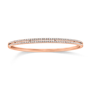 Diamond Double Row Bangle Bracelet - 18K rose gold weighting 11.70 grams. - 118 Round Diamonds totaling 0.96 carats.