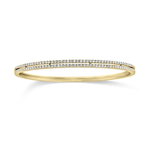Diamond Double Row Bangle Bracelet - 18K yellow gold weighting 11.70 grams. - 118 Round Diamonds totaling 0.96 carats.