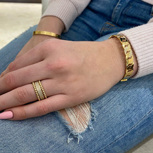 Female Model Wearing Pave Diamond Chain Link Bangle Bracelet  - 14K gold weighing 17.77 grams  - 66 round diamonds totaling 0.15 carats