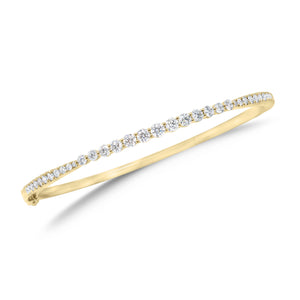 Graduated Diamond Bangle Bracelet - 18K yellow gold weighing 10.79 grams - 22 round diamonds totaling 0.39 carats - 13 round diamonds totaling 0.91 carats