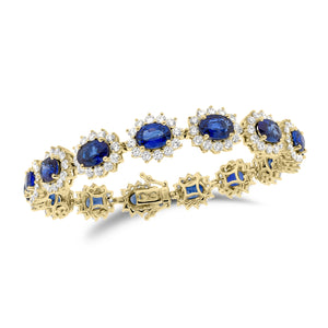 Sapphire & Diamond Wreath Bracelet  - 18K gold weighing 20.37 grams  - 180 round diamonds totaling 5.29 carats  - 15 sapphires totaling 13.14 carat