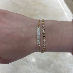 Female model wearing Double Cable Chain Bracelet with Diamond Bar - 14K gold weighing 3.10 grams - 145 round diamonds totaling 0.37 carats