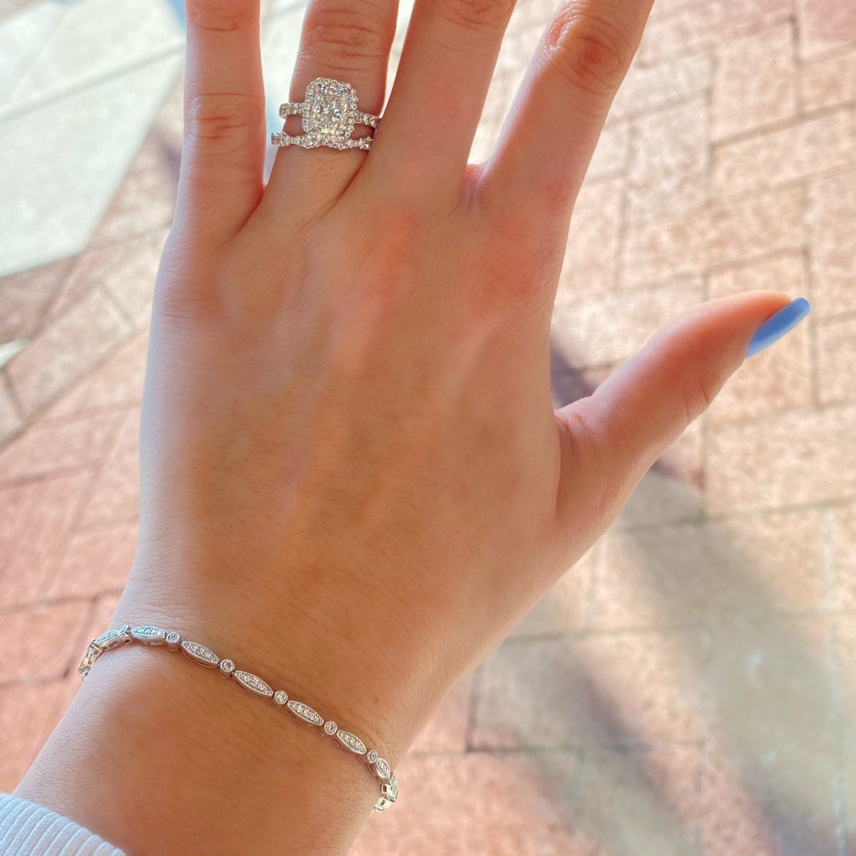 Female Model Wearing  Diamond Marquises & Circles Tennis Bracelet  - 18K gold weighing 8.44 grams  - 108 round diamonds totaling 0.65 carats