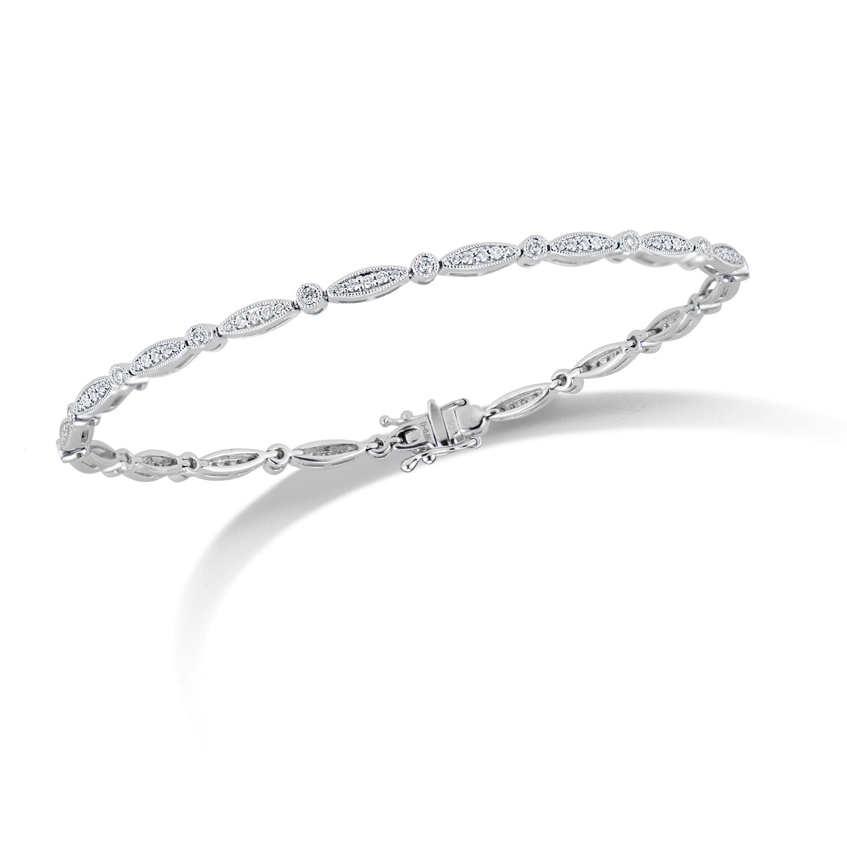 Diamond Marquises & Circles Tennis Bracelet  - 18K gold weighing 8.44 grams  - 108 round diamonds totaling 0.65 carats