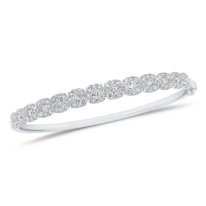 Solid 18K white gold weighing 12.93 grams featuring 104 round diamonds weighing 1.58 carats and 13 round diamonds weighing 0.99 carats Halo Diamond Bangle Bracelet | Nuha Jewelers