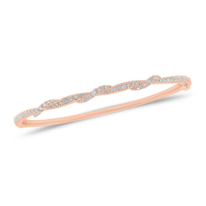 Solid 18k rose gold weighing 9.14 grams with 65 round diamonds weighing 0.67 carats Diamond Twist Bangle | Nuha Jewelers