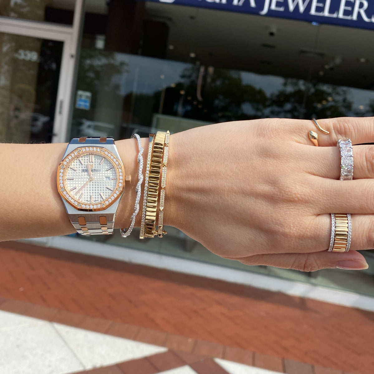 Female model wearing Solid 18k white gold weighing 9.14 grams with 65 round diamonds weighing 0.67 carats Diamond Twist Bangle | Nuha Jewelers