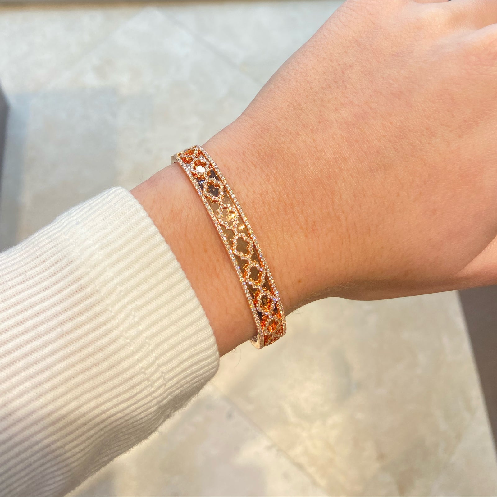 Diamond Quatrefoil Bangle -14K rose gold weighing 24.16 grams -350 round diamonds totaling 1.10 carats