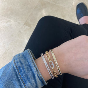 Female model wearing Gold Tri-Link Bracelet with Diamond Accent Piece - 14K gold weighing 12.70 grams - 248 round diamonds totaling 0.67 carats