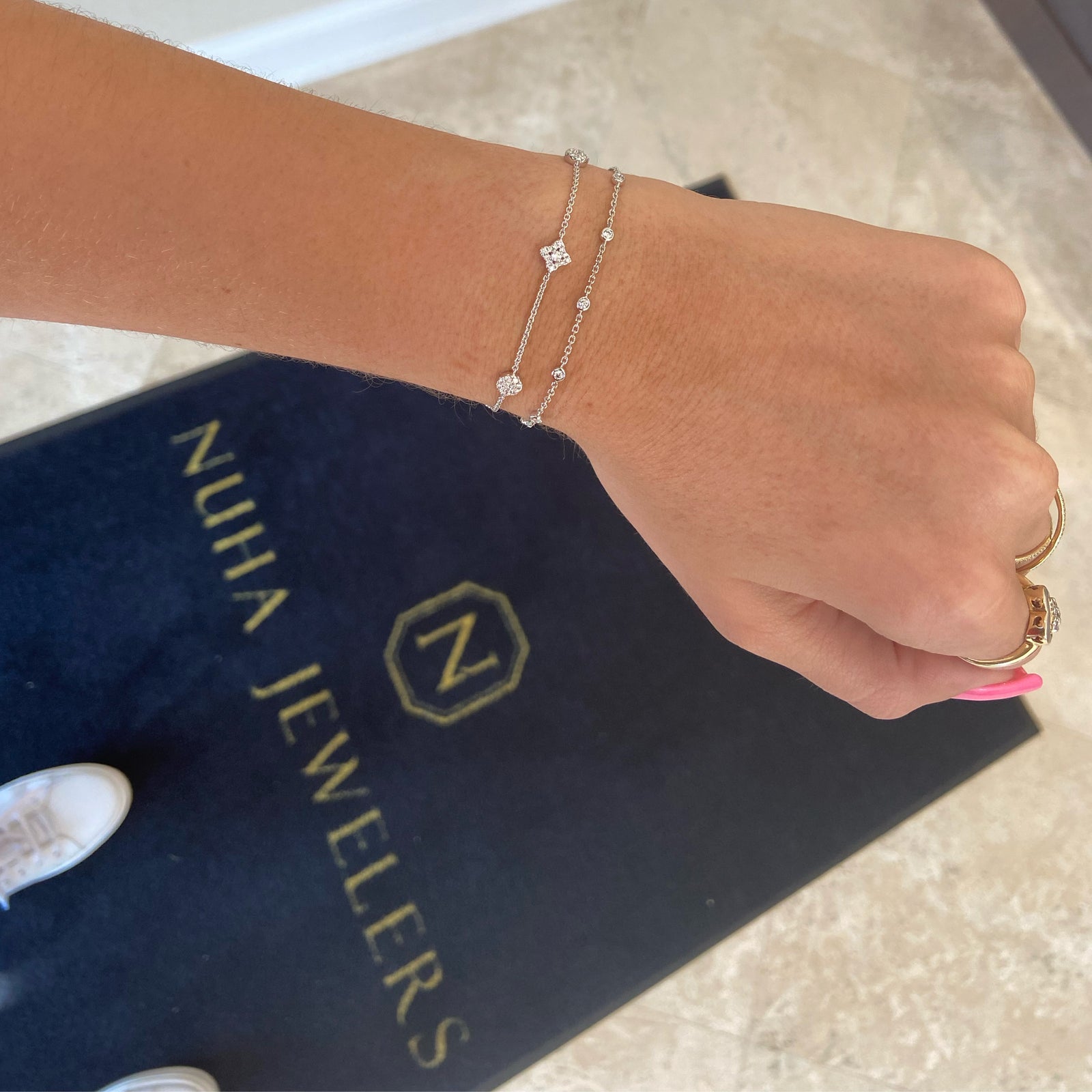 Diamonds by the Yard 10-Stone Bracelet - 18K white gold weighing 2.11 grams - 10 round diamonds totaling 0.28 carats