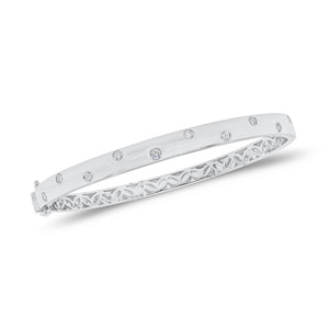 Solid 18K white gold weighing 17.26 grams with 10 round diamonds weighing 0.40 carats Diamond Dot Bangle | Nuha Jewelers