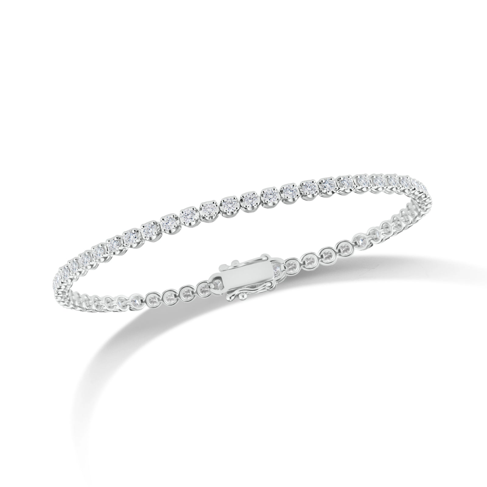 Diamond Slim Classic Tennis Bracelet  - 14K gold weighing 6.46 grams  - 61 round diamonds totaling 1.53 carats