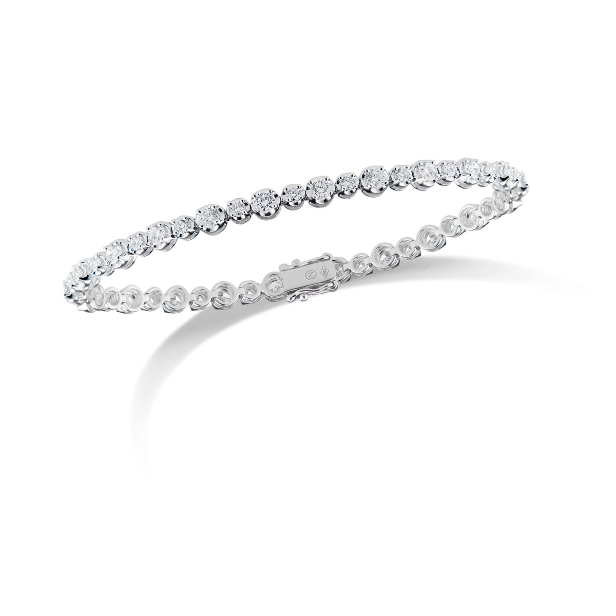 Diamond Classic Tennis Bracelet  - 18K gold weighing 7.84 grams  - 24 round diamonds totaling 2.00 carats  - 24 round diamonds totaling 0.79 carats
