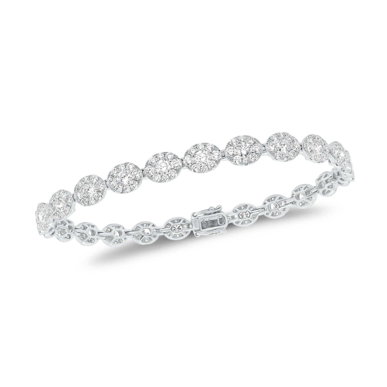 Diamond Oval Link Bracelet  - 18K gold weighing 9.81 grams  - 25 round diamonds totaling 2.18 carats  - 200 round diamonds totaling 3.43 carats