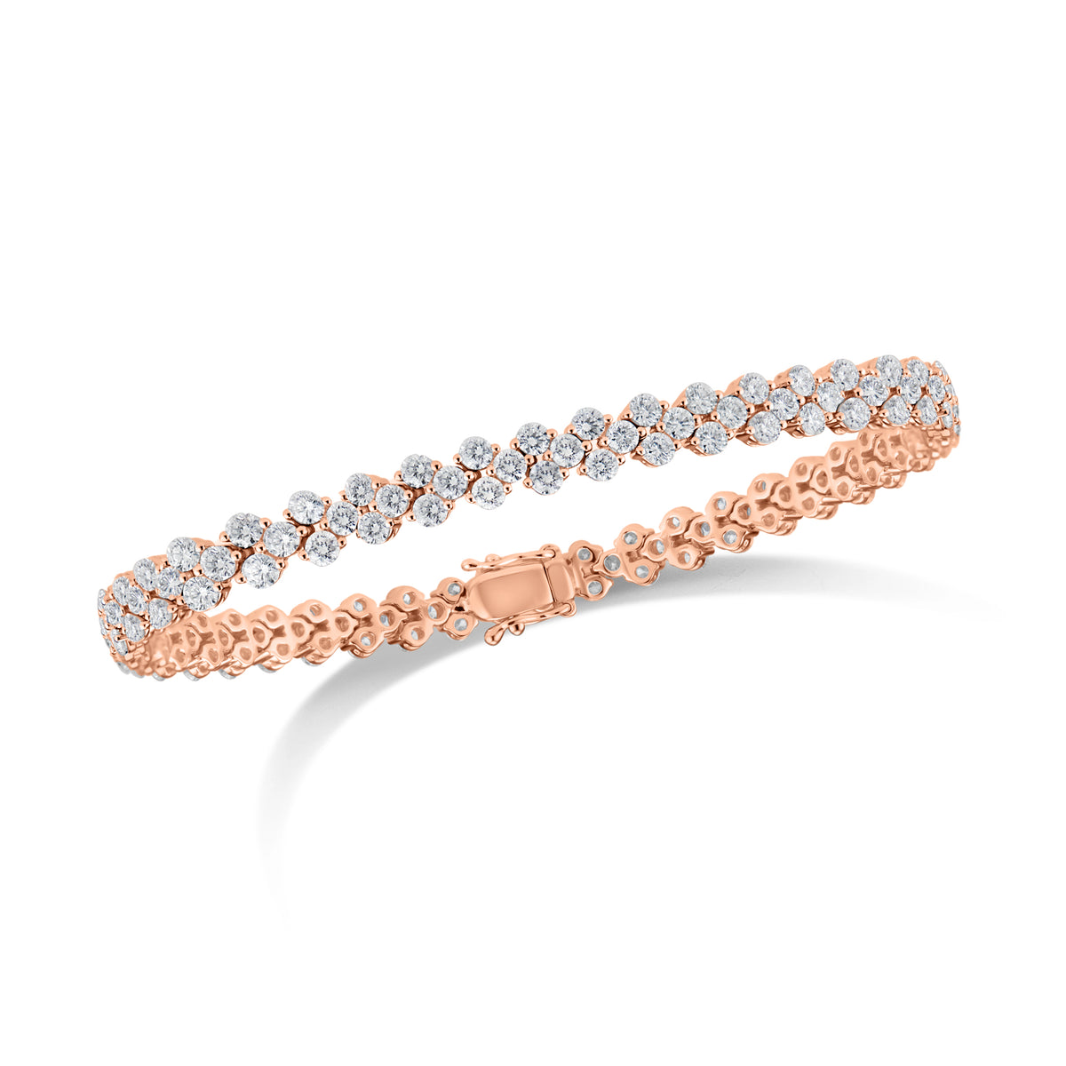 Diamond Quatrefoil Tennis Bracelet  - 18K gold weighing 12.62 grams  - 141 round diamonds totaling 5.64 carats