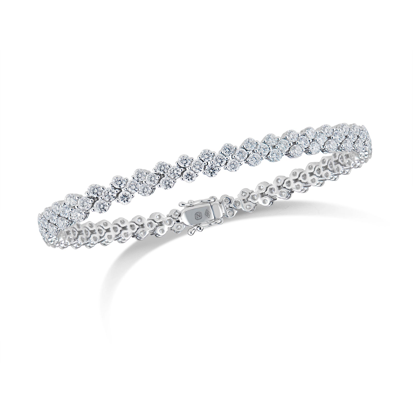 Diamond Quatrefoil Tennis Bracelet  - 18K gold weighing 12.62 grams  - 141 round diamonds totaling 5.64 carats