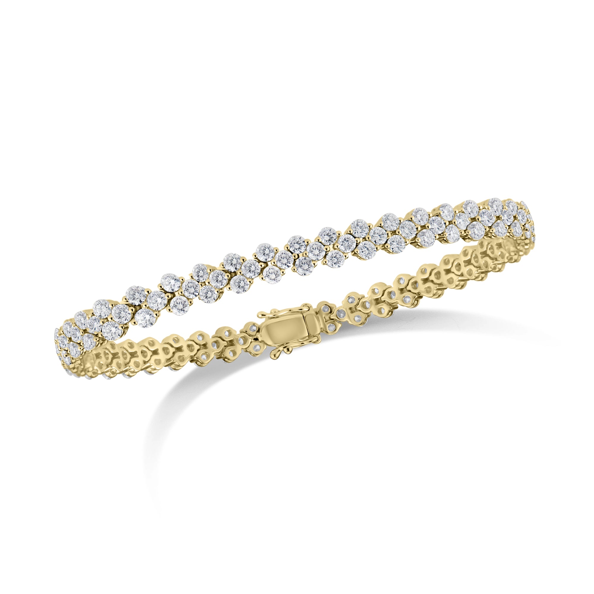 Diamond Quatrefoil Tennis Bracelet  - 18K gold weighing 12.62 grams  - 141 round diamonds totaling 5.64 carats