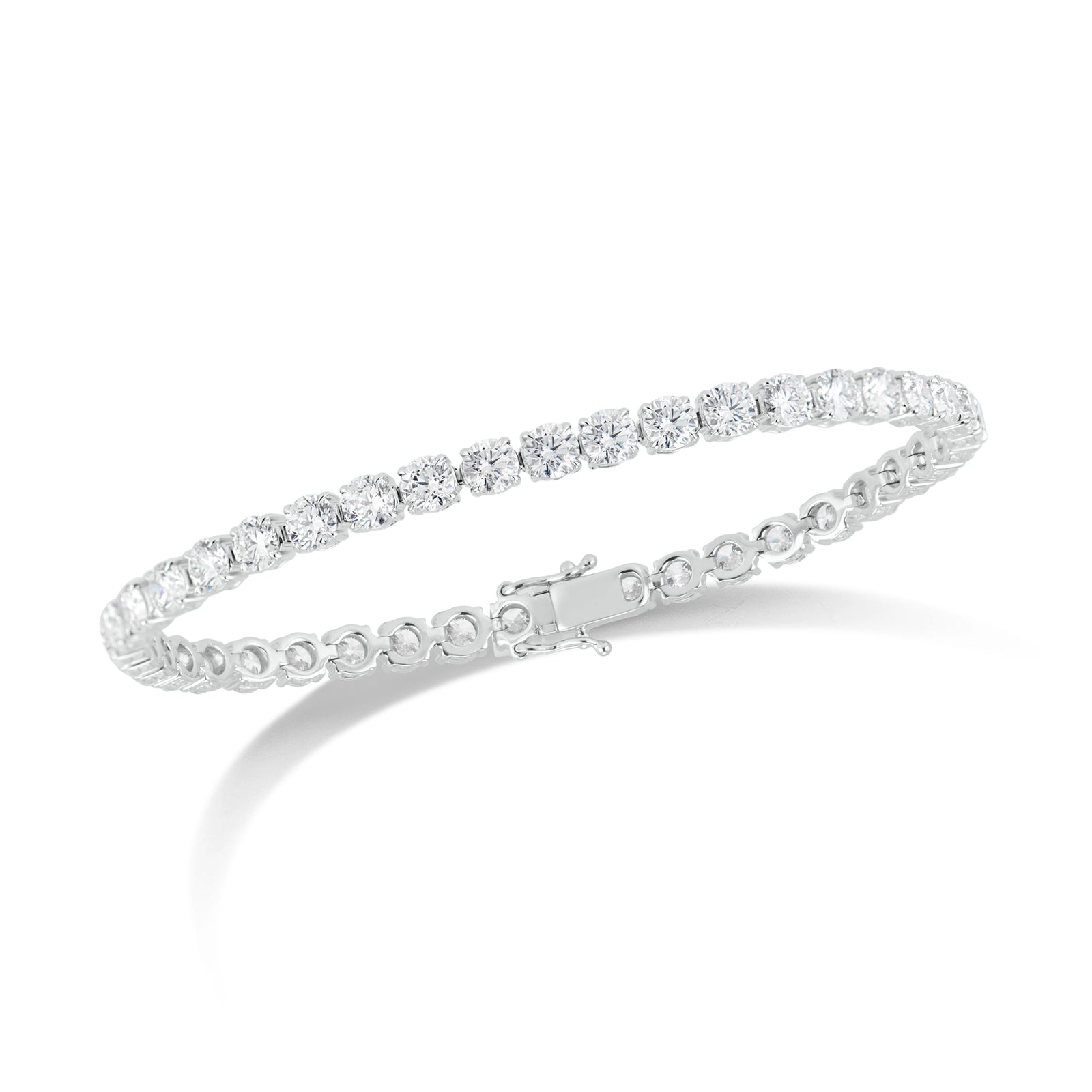 10 ct Diamond Tennis Bracelet - 18K gold weighing 14.28 grams  - 41 round diamonds totaling 10.20 carats (GIA-graded F-G color, VS2-SI1 clarity)  -152 round diamonds totaling 0.49 carats