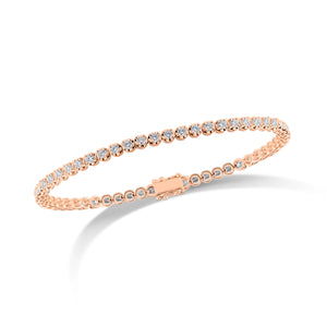 Diamond Small Tennis Bracelet - 14K rose gold weighing 5.28 grams - 57 round diamonds totaling 1.98 carats Box clasp closure with safety hooks.