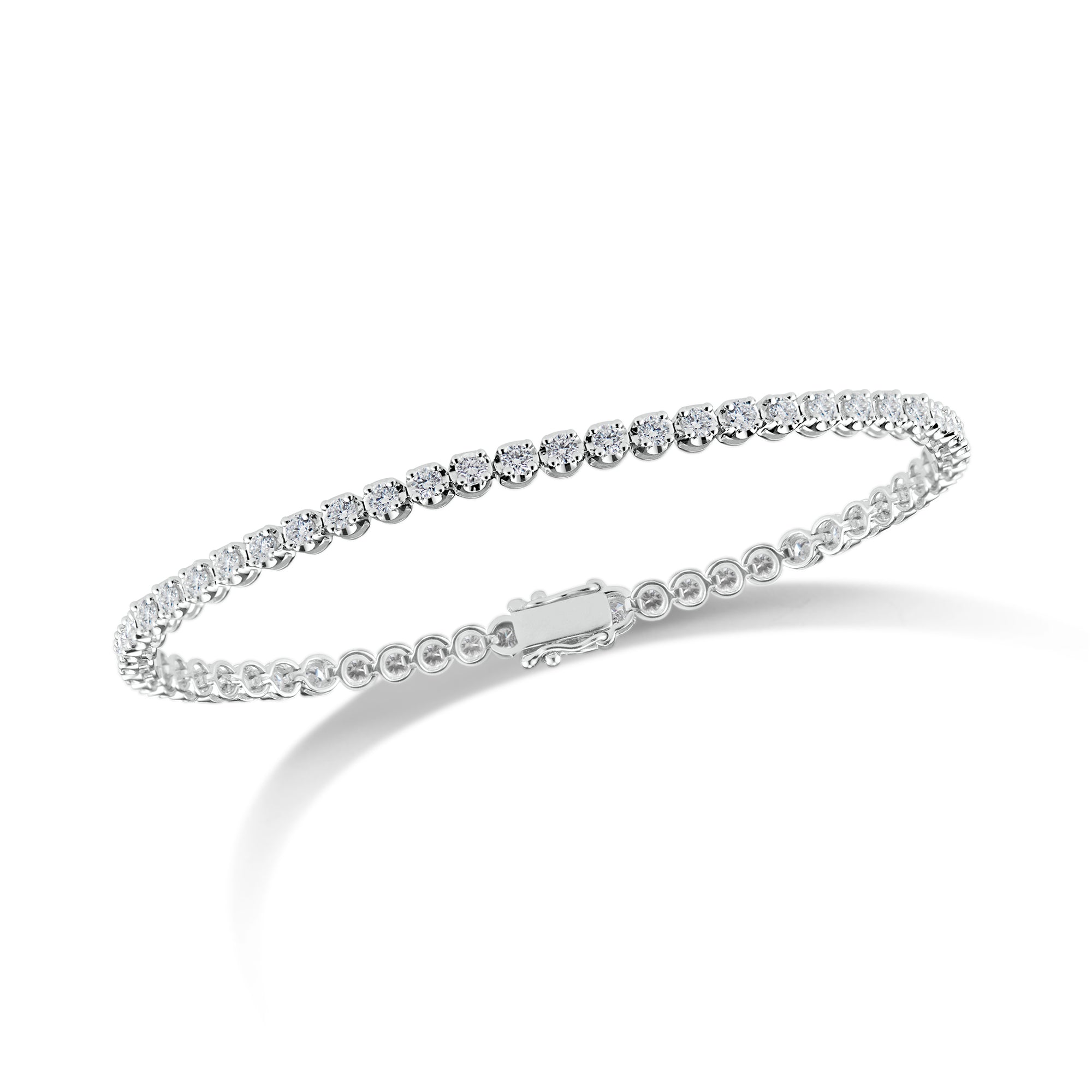 Diamond Small Tennis Bracelet - 14K white gold weighing 5.28 grams - 57 round diamonds totaling 1.98 carats Box clasp closure with safety hooks.