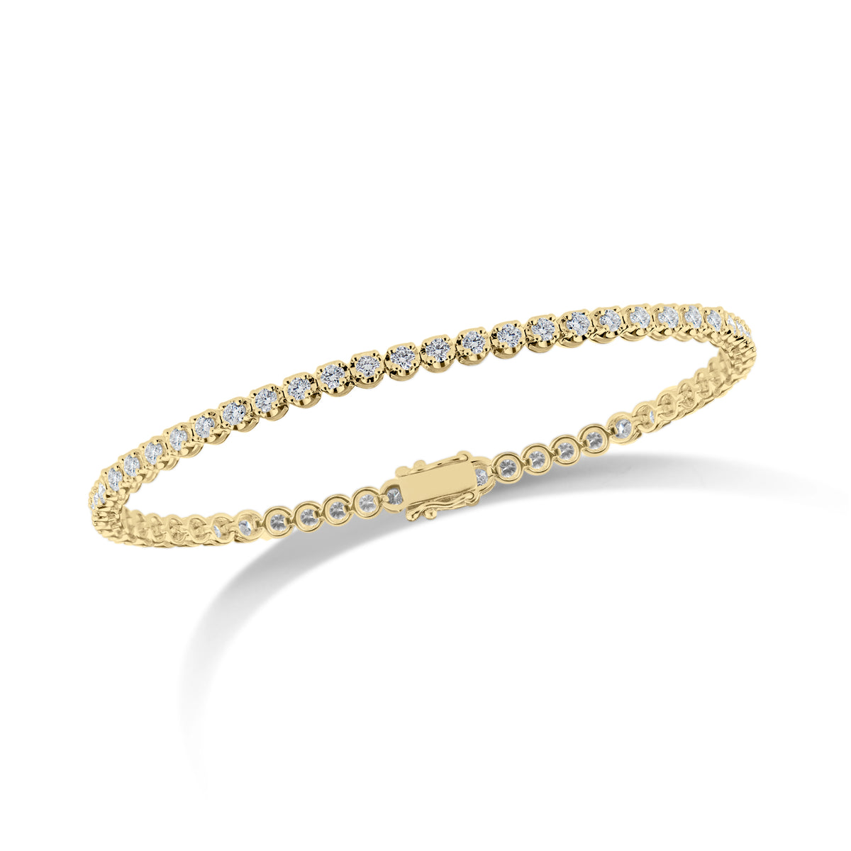 Diamond Small Tennis Bracelet - 14K yellow gold weighing 5.28 grams - 57 round diamonds totaling 1.98 carats Box clasp closure with safety hooks.