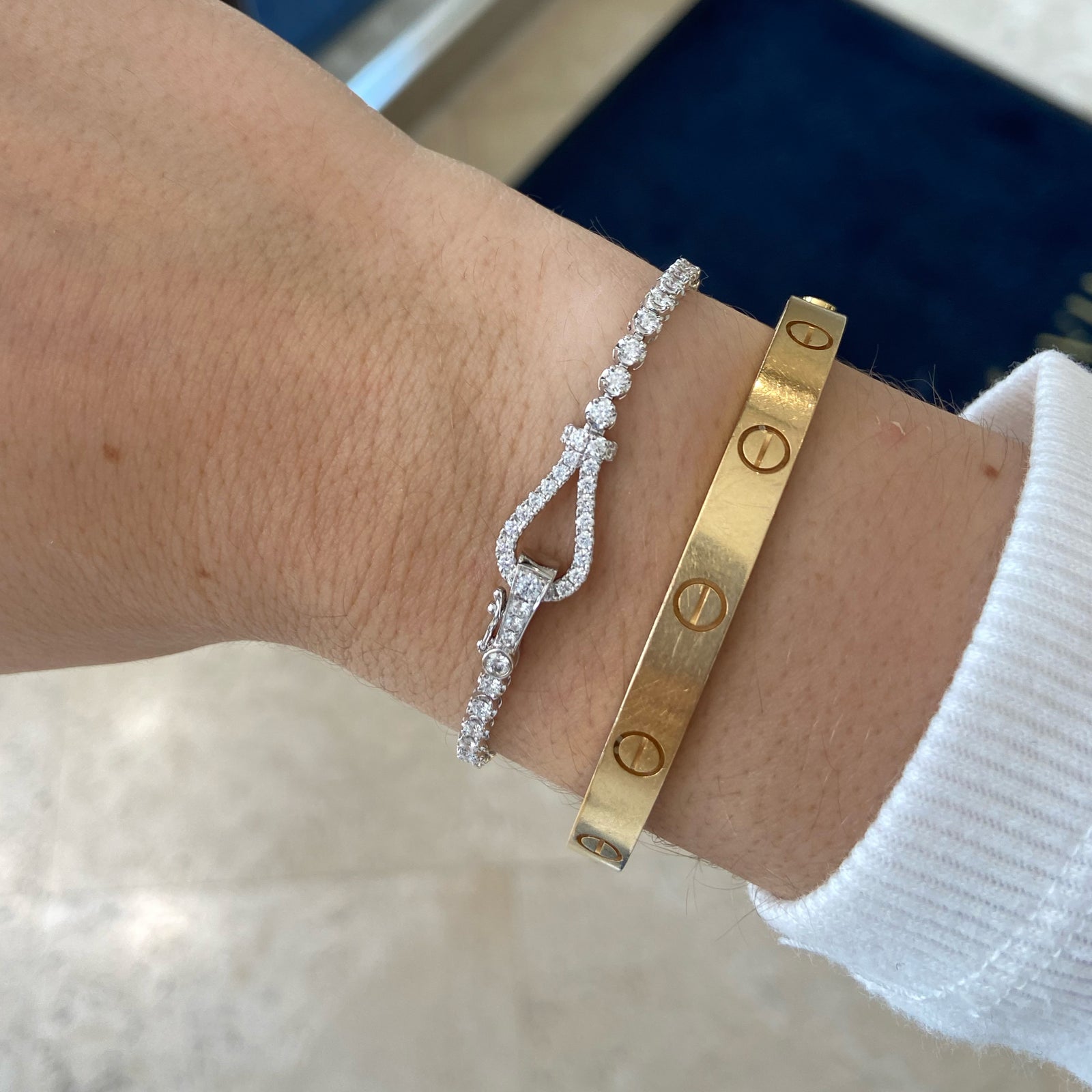 Round Diamond Lasso Tennis Bracelet  - 18K gold weighing 6.70 grams  - 76 round diamonds totaling 2.08 carats