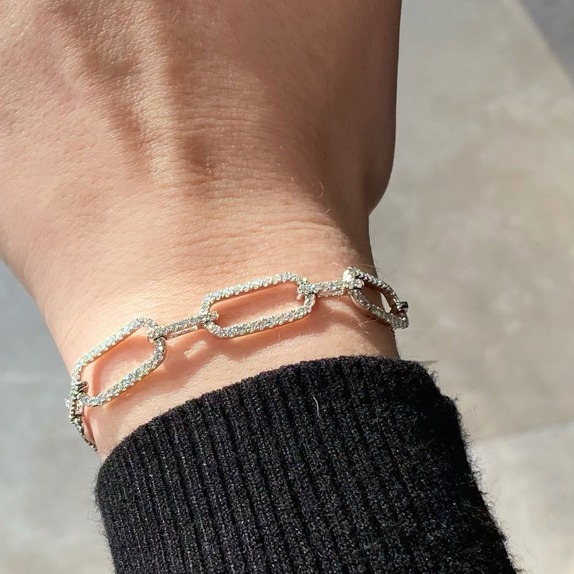 Female Model Wearing Diamond Wide Rectangular Link Bracelet  - 18K gold weighing 12.34 grams  - 249 round diamonds totaling 3.13 carats