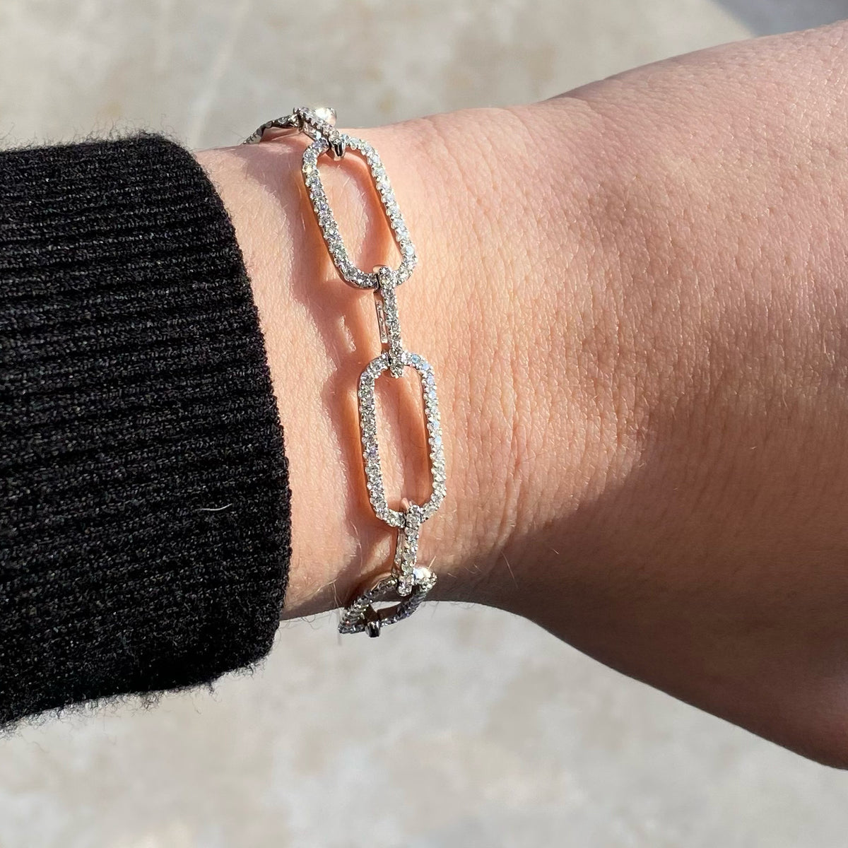 Female Model Wearing Diamond Wide Rectangular Link Bracelet  - 18K gold weighing 12.34 grams  - 249 round diamonds totaling 3.13 carats