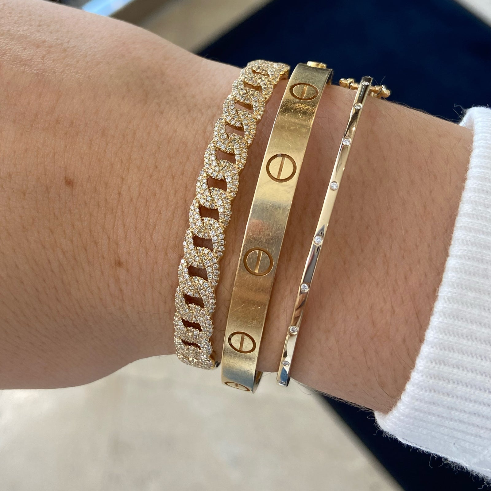 Diamond Slim Dotted Bangle Bracelet  - 14K gold weighing 5.61 grams  - 10 round diamonds totaling 0.06 carats