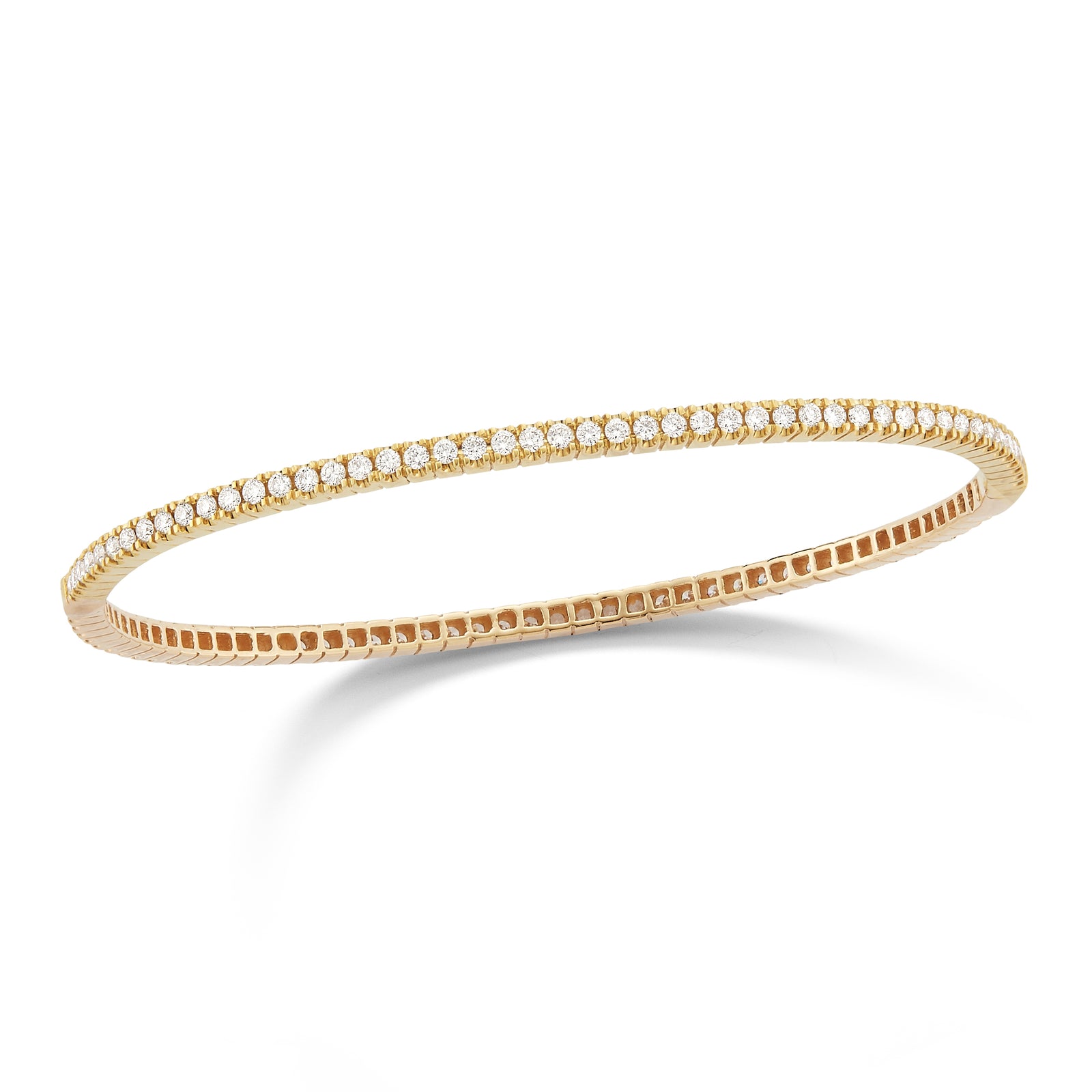 Diamond Eternity Bangle Bracelet  -14K gold weighing 10 grams  -94 shared prong-set round diamonds totaling 1.50 carats