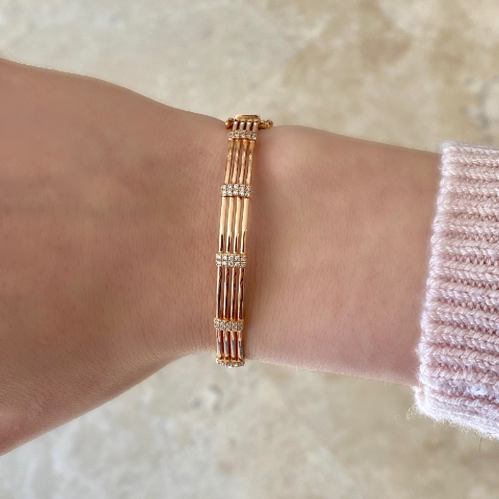 Diamond Multilayer Bangle Bracelet -14K rose gold weighing 12.42 grams -100 round prong set diamonds totaling 0.62 carats