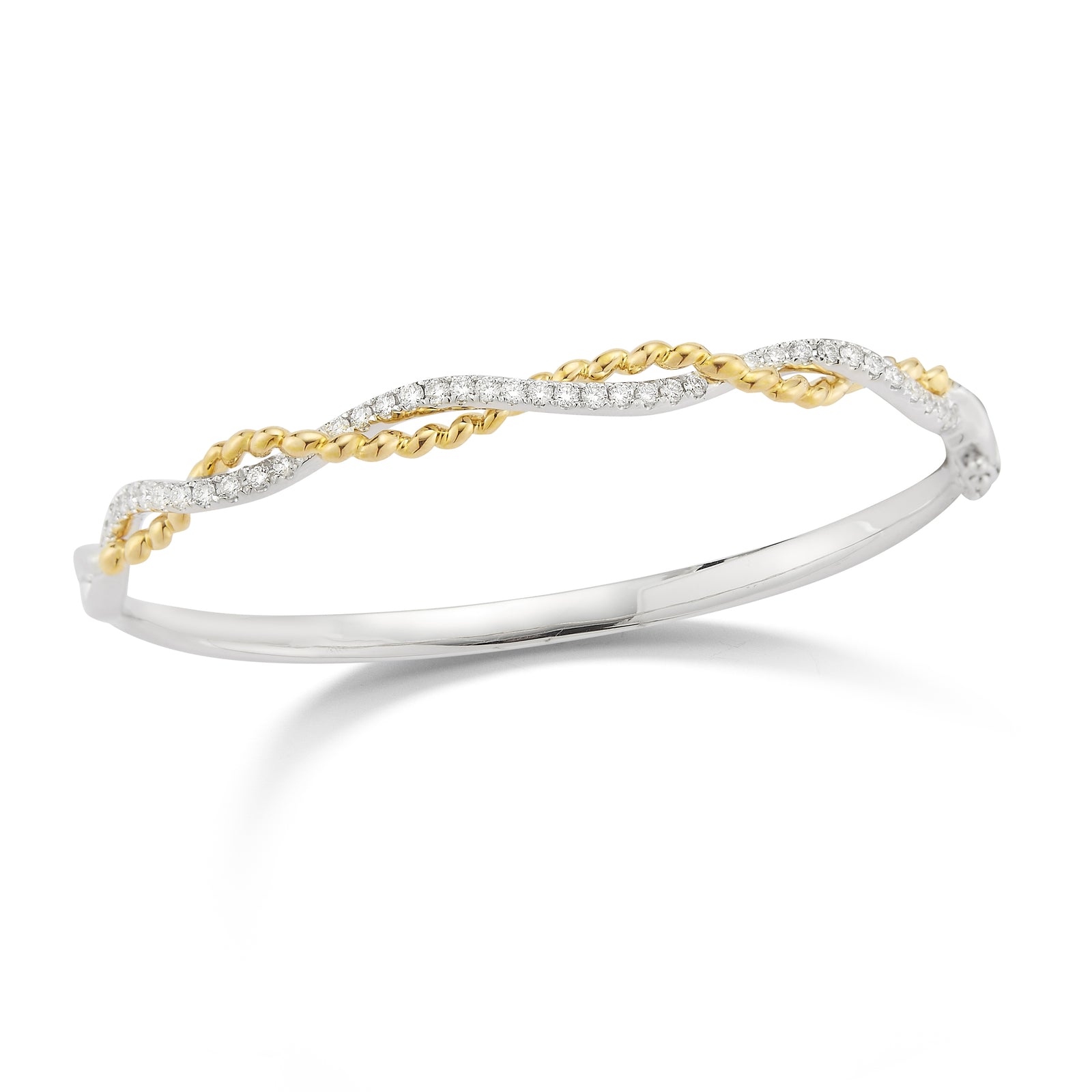 Diamond Twist Bangle Bracelet   -18K gold weighing 18.57 grams  -39 round shared prong-set diamonds totaling 0.70 carats.