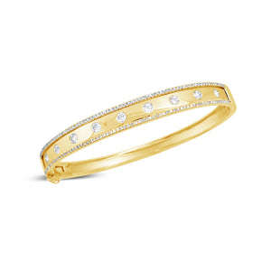Bezel-Set & Pave Diamond Wide Bangle Bracelet -14K yellow gold weighing 14.45 grams -9 round bezel set diamonds totaling 0.52 carats -146 round pave set diamonds totaling 0.44 carats
